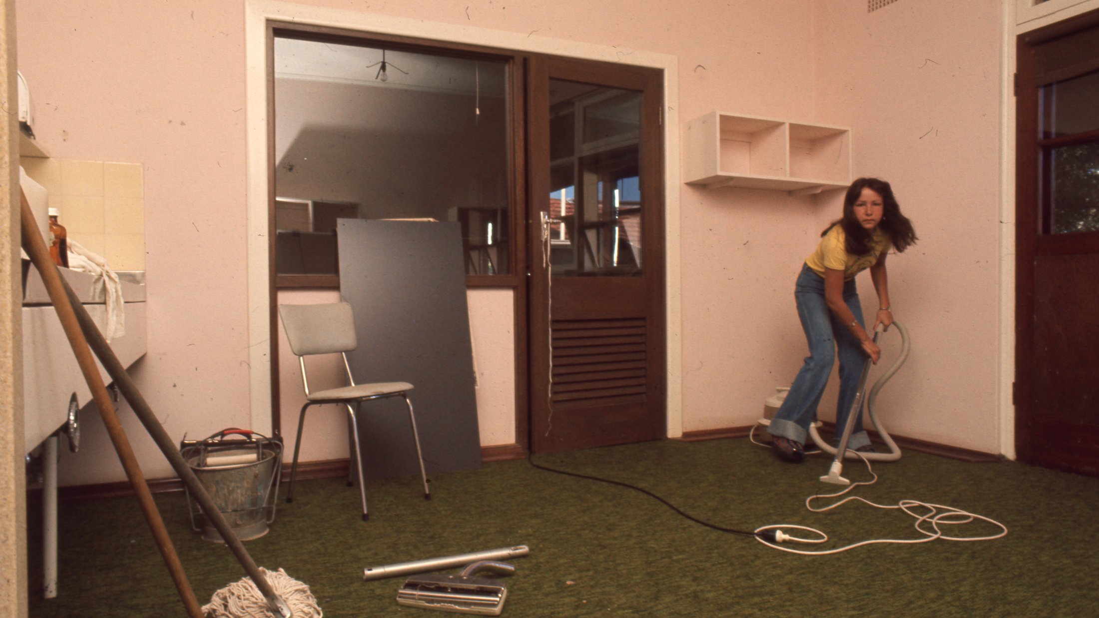 1970-80 - KC - Woman Vacuuming (poss. Reno)